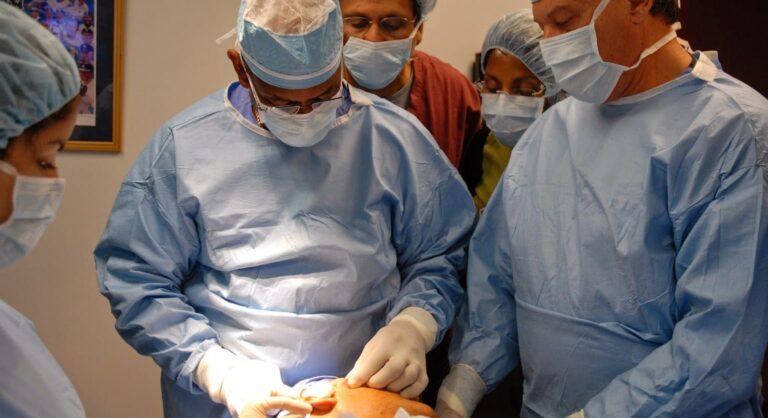 Dr. Reynolds conducts a suture suspension lift as trainees observe.