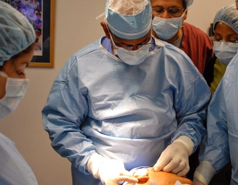 Dr. Reynolds conducts a suture suspension lift as trainees observe.